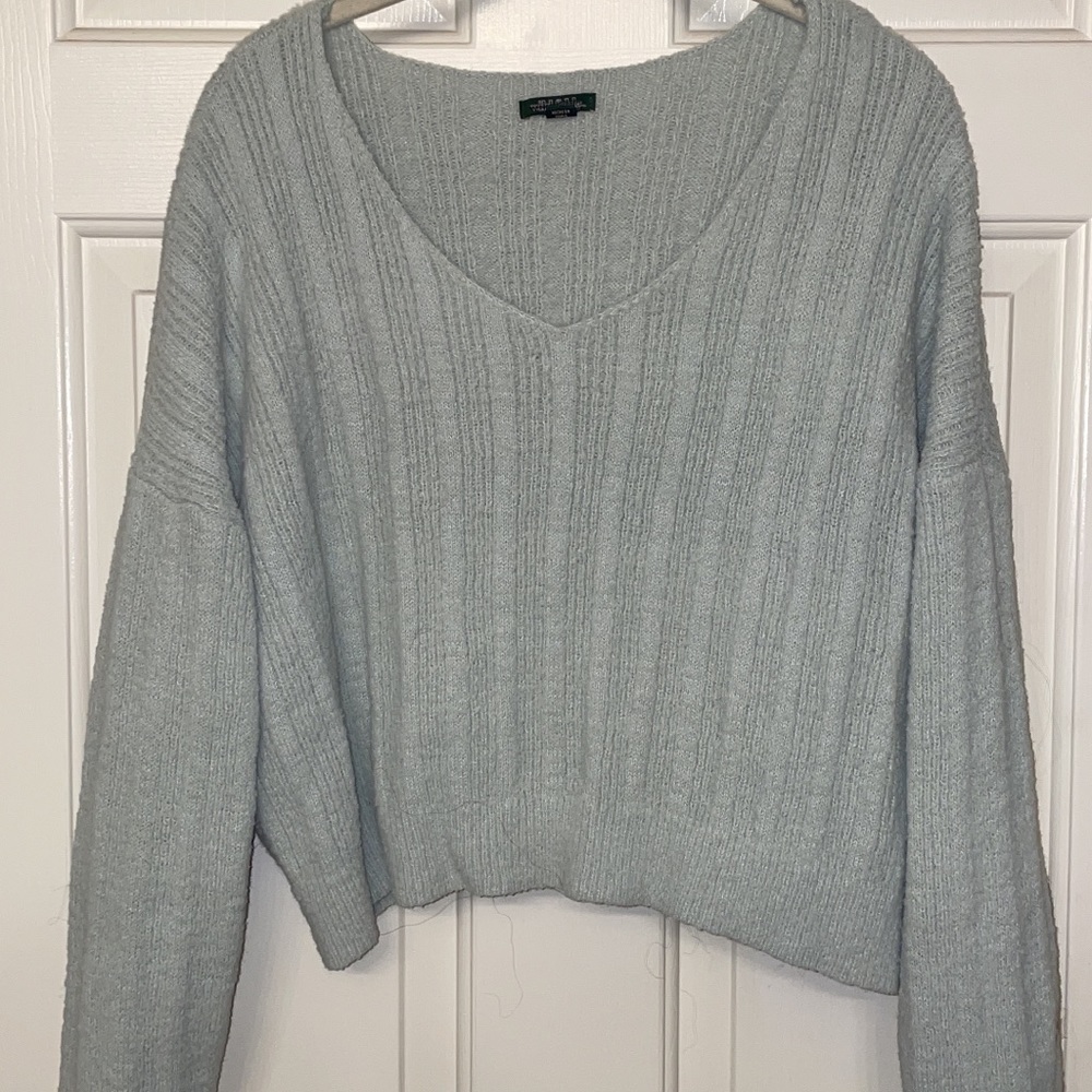 Light bluish gray crop sweater.
